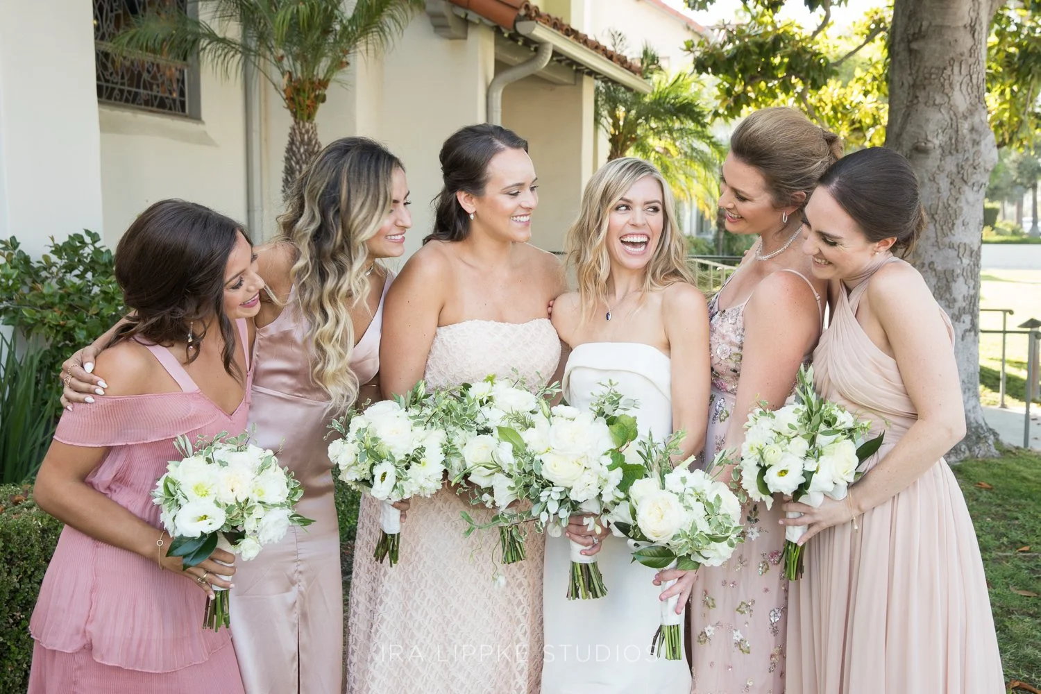 Bridesmaid bouquets in soft pastels